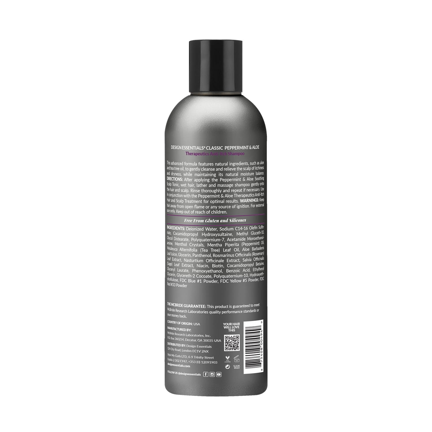 Close-up of Design Essentials peppermint aloe anti-itch shampoo label highlighting zinc-based formula for flake control.