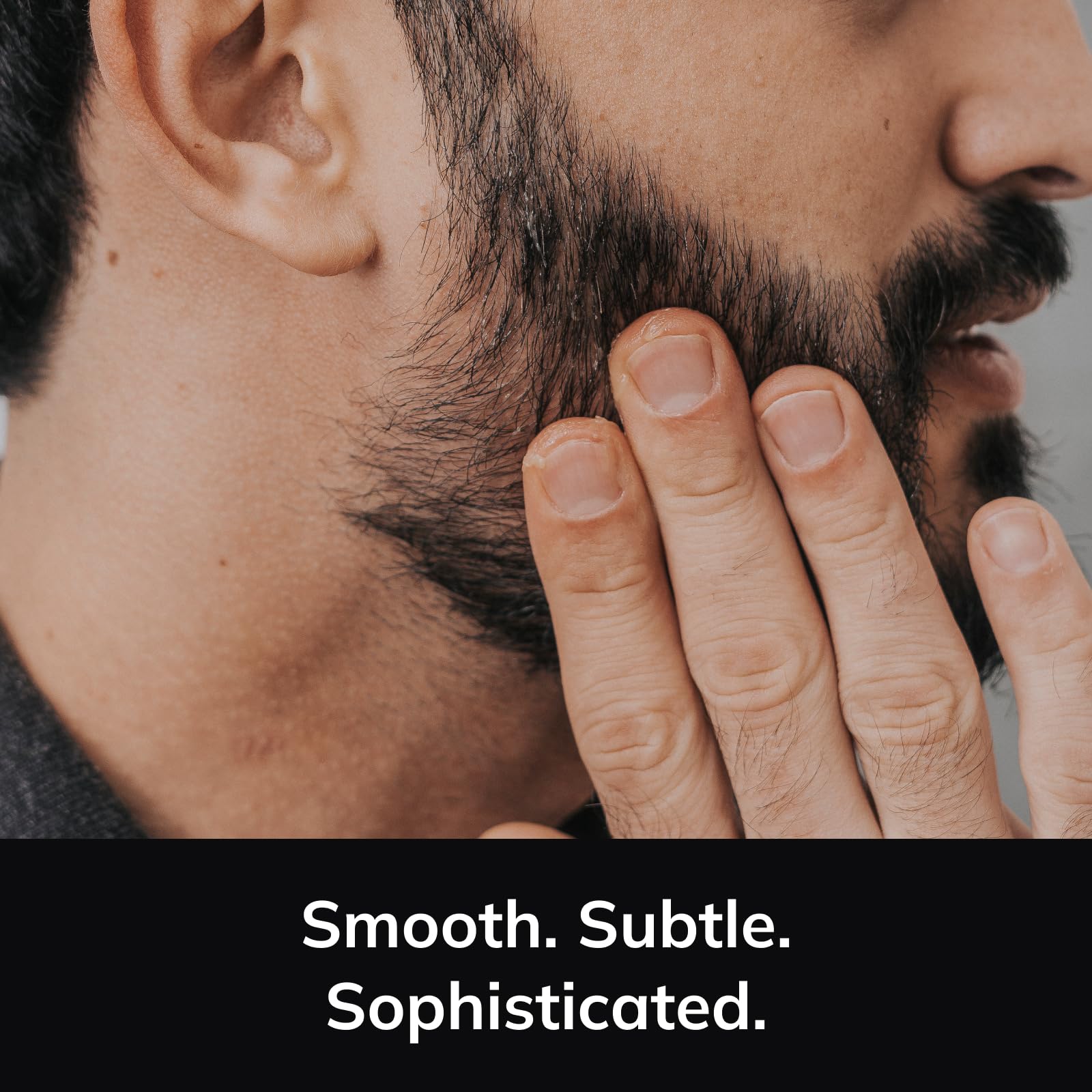 Beard oil application close-up from Detroit Grooming Co. for smooth grooming