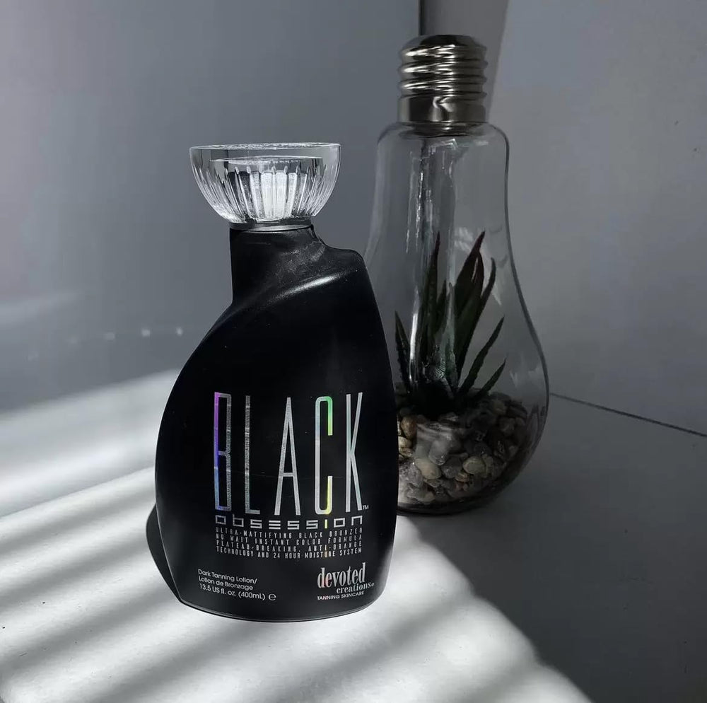 Devoted Creations Black Obsession deep tan swatch reveals natural-looking bronze shade