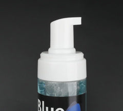 Creamy blue foam lather on skin highlighting thorough cleansing