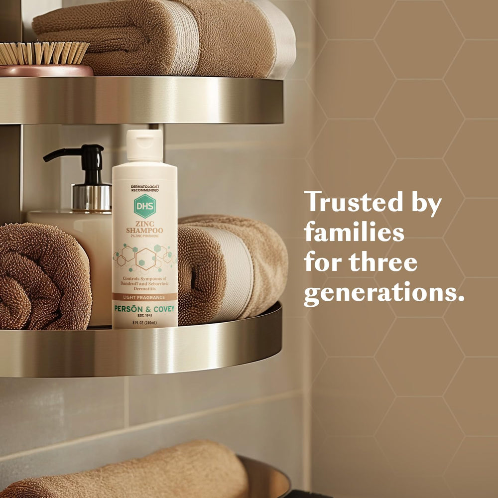 DHS Zinc Shampoo on bathroom counter with packaging and branding.