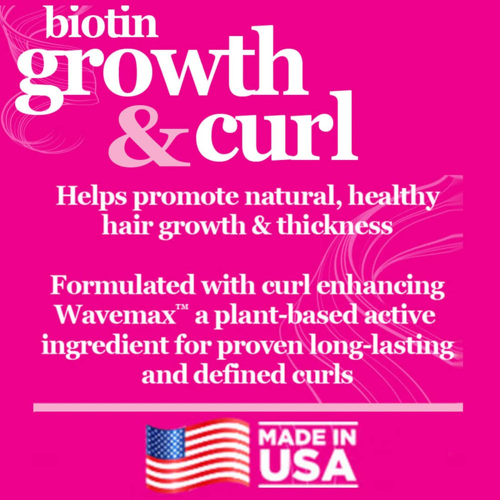 Difeel Biotin Growth & Curl Oil closeup on silky hair fibers.