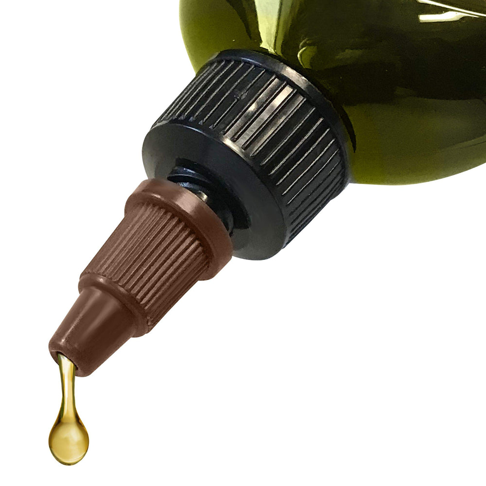Difeel bottle texture close-up showing conditioning oil on hair strands.