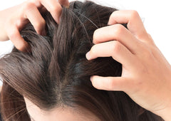 Difeel premium hair oil application on scalp for soothing nourishment