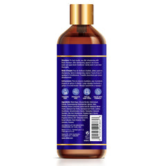 Difeel Pro-Growth Biotin Conditioner label closeup emphasizing fortifying ingredients.