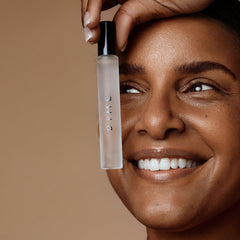 DIME Beauty 7 Summers travel spray packaging box displayed beside the bottle