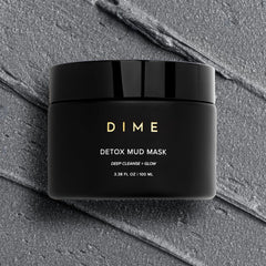 DIME Beauty Detox Mud Mask spatula application on skin for refreshing cleansing.