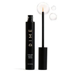 DIME Beauty eyelash boost serum bottle close-up for healthy lash nourishment.