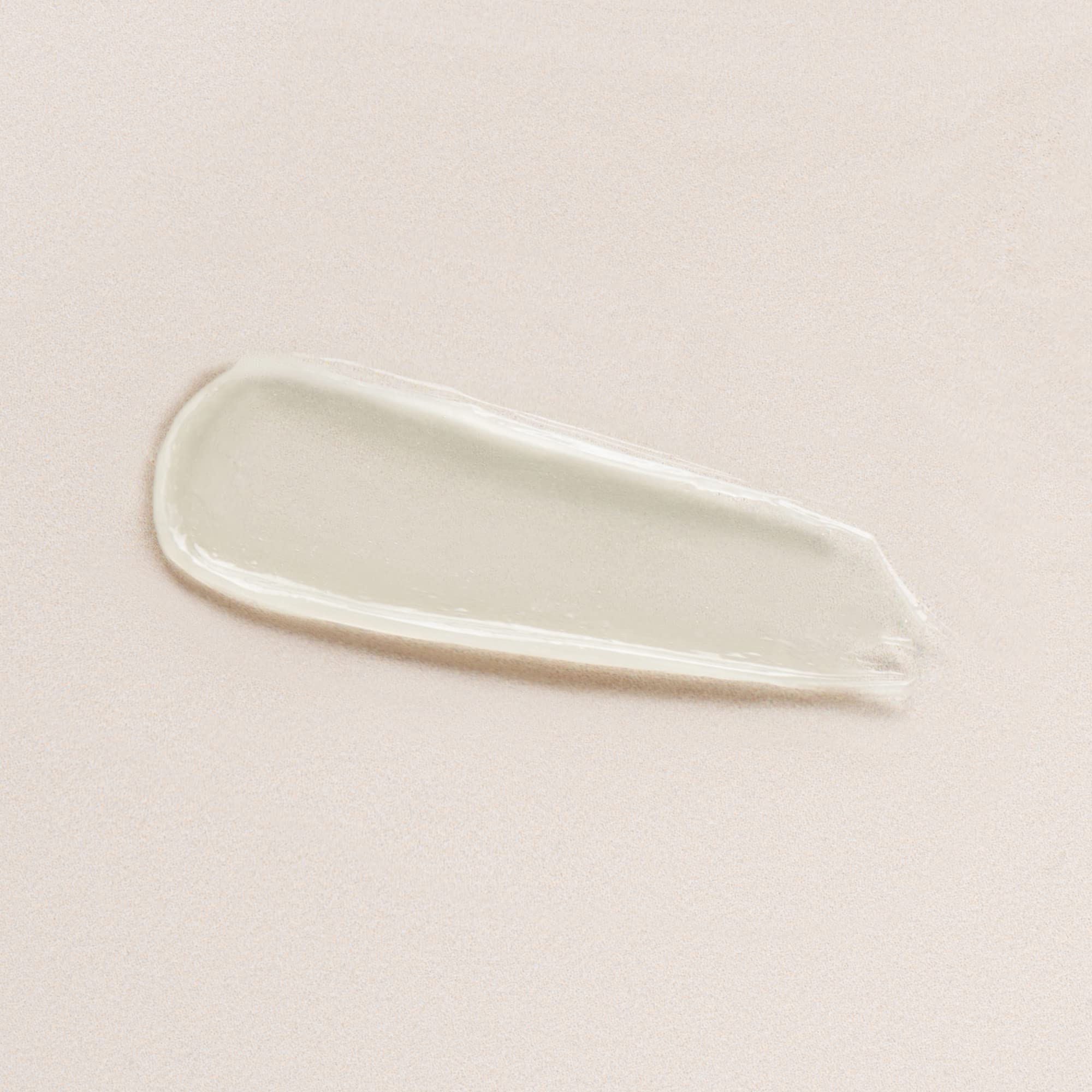 Close-up of DIME Lip Balm jar reveals creamy, nourishing texture.