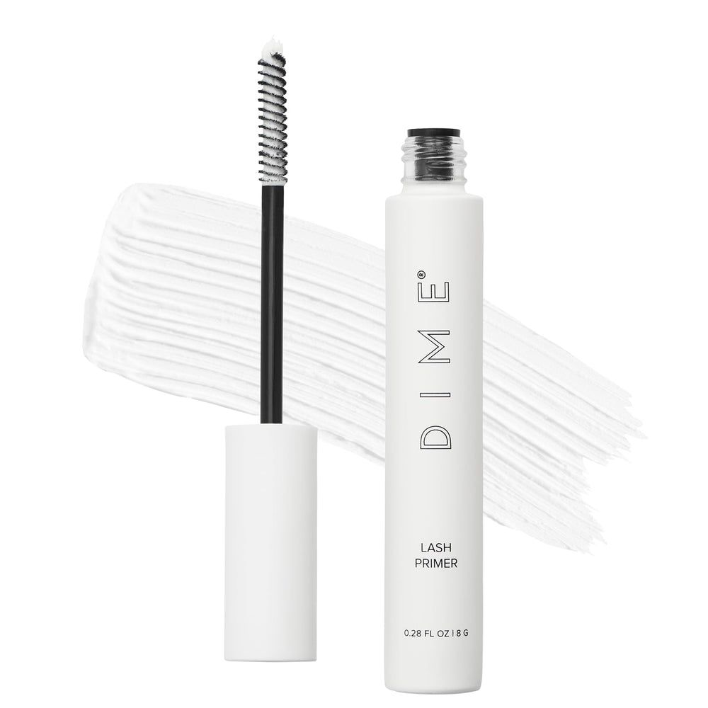 DIME Lash Primer bottle close-up showing white formula for lash prep
