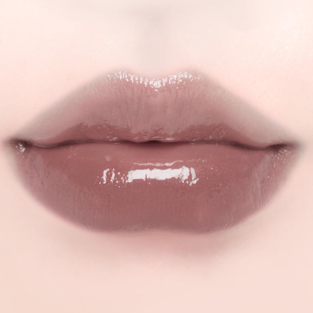 DINTO Blur-Glowy MINI Lip Tint 259 Deus displays vivid color with lasting glossy finish.