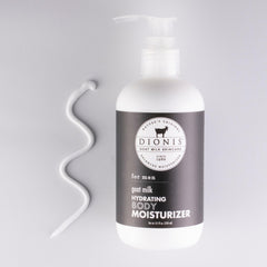 Label close-up on Dionis goat milk lotion highlighting masculine fragrance.