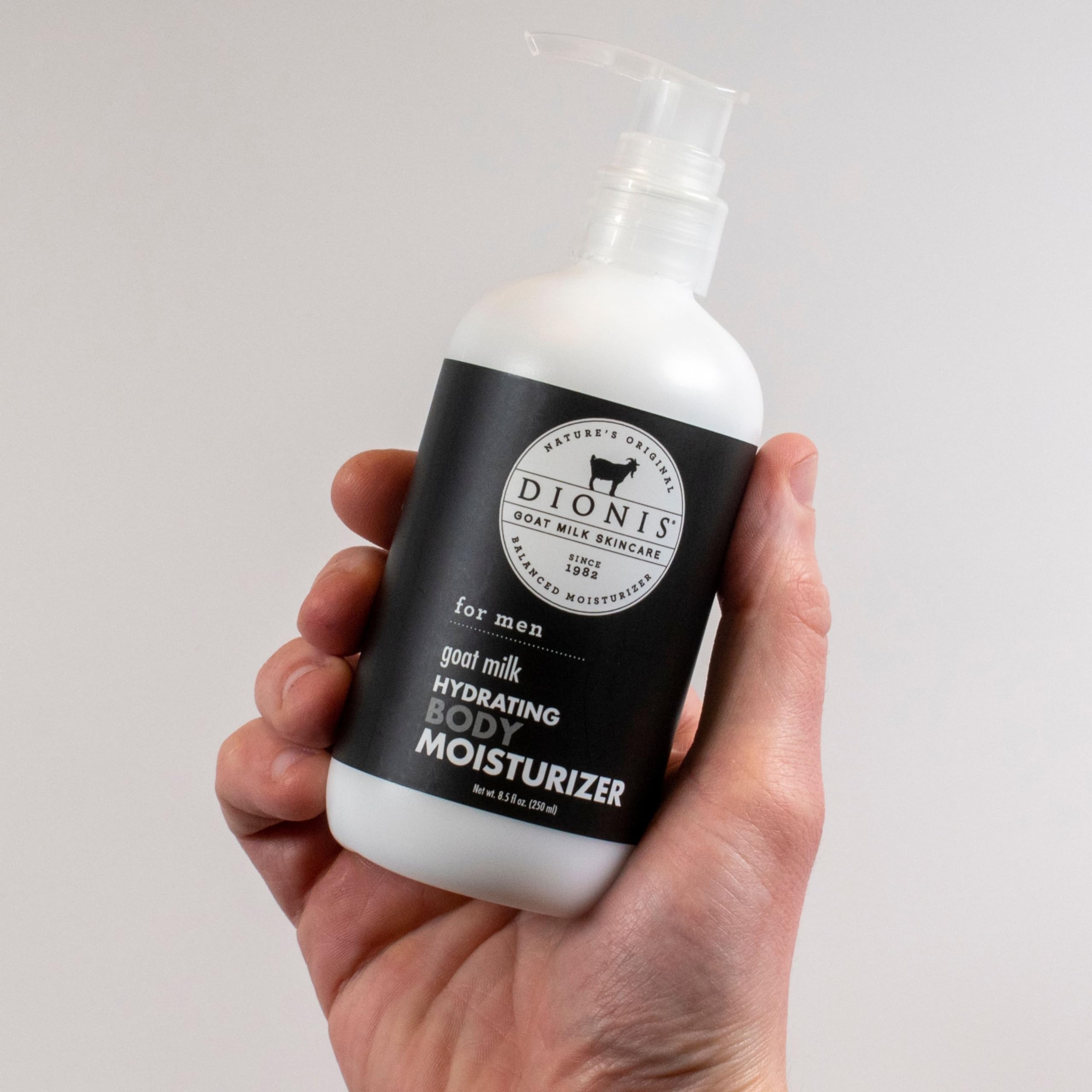 Man applying Dionis fresh scented lotion for moisturized skin after shower.
