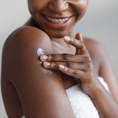 Lotion being applied to arm for daily hydration