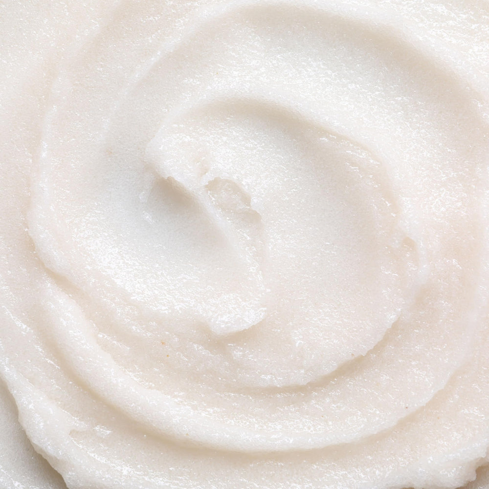 Dionis Goat Milk Whipped Scrub jar application shot highlights gentle exfoliation