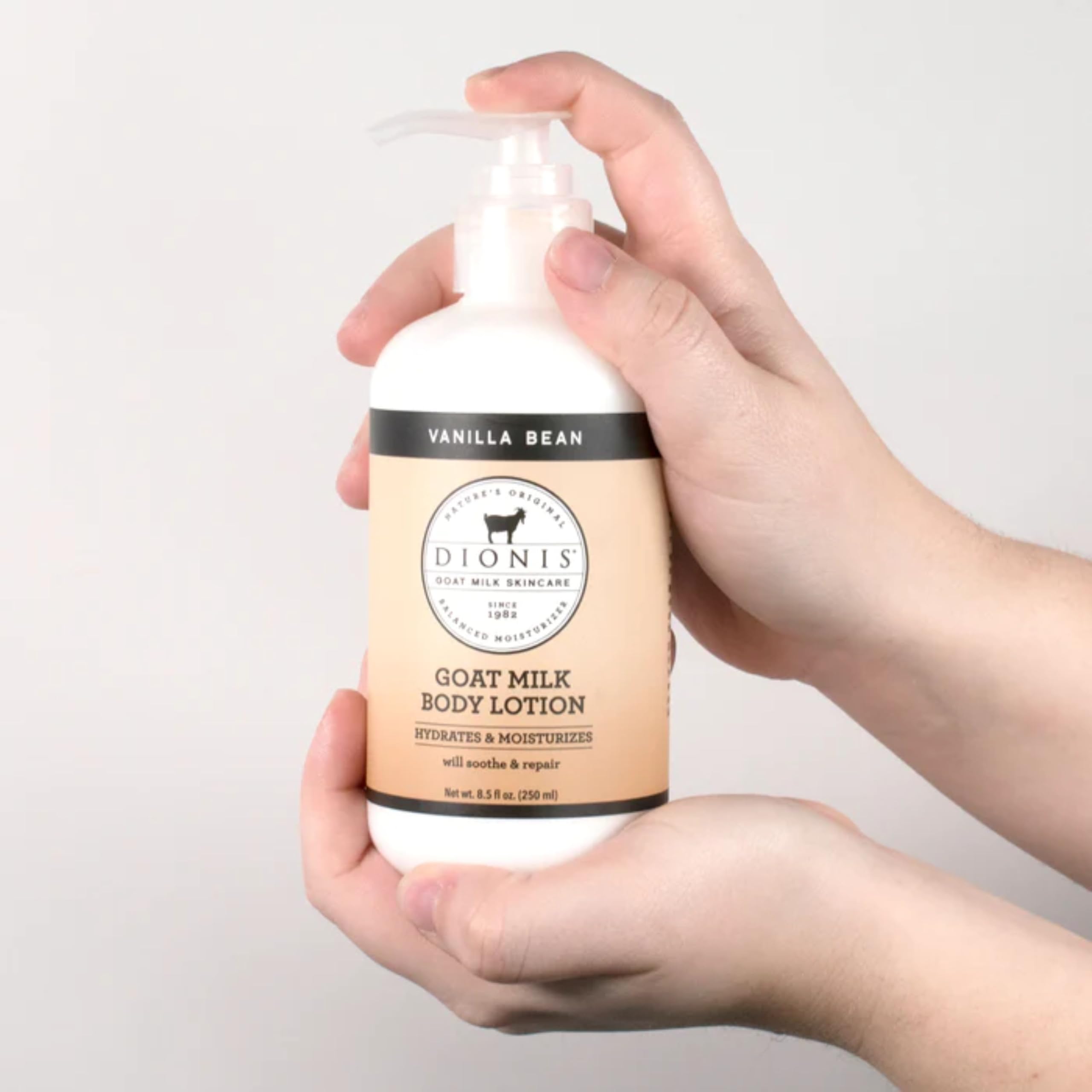 Hand applying Dionis hand cream to dry skin.