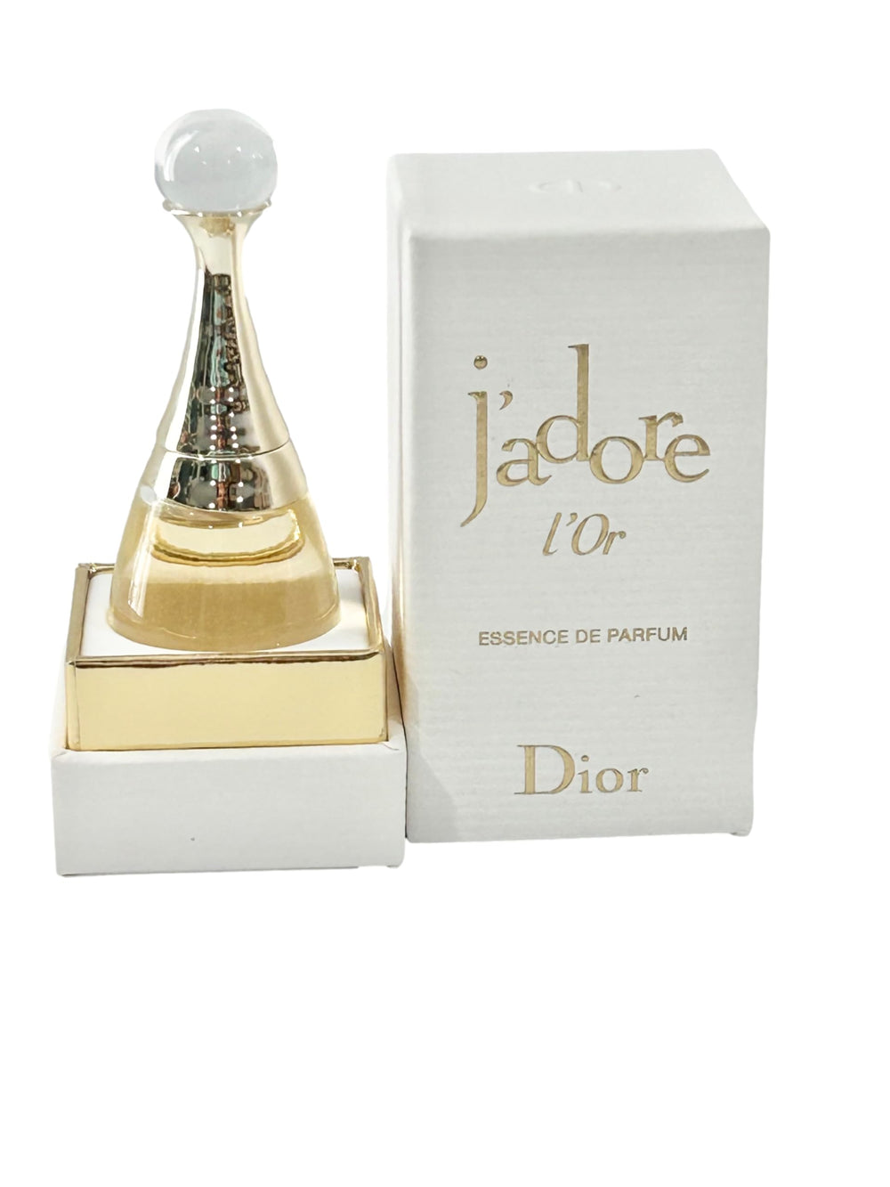 Dior J'adore Essence L'Or mini bottle pour travel-ready elegance and floral notes.