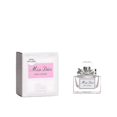 Miss Dior Rose N' Roses bottle with silver ribbon conveys elegant gifting appeal.