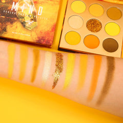 Close-up of yellow metal sequin from Docolor palette for luxe sparkle