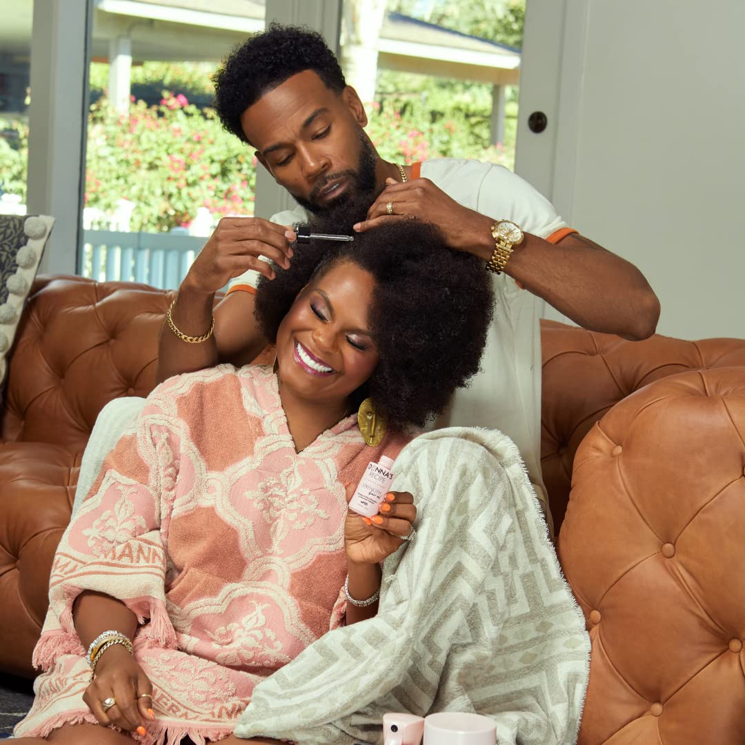 Donna's Recipe Strength Hair Oil in use pump for easy daily application.