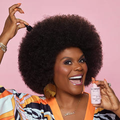 Donna's Recipe Strength Hair Oil ingredients close-up highlights nutrient-rich oils and botanicals.