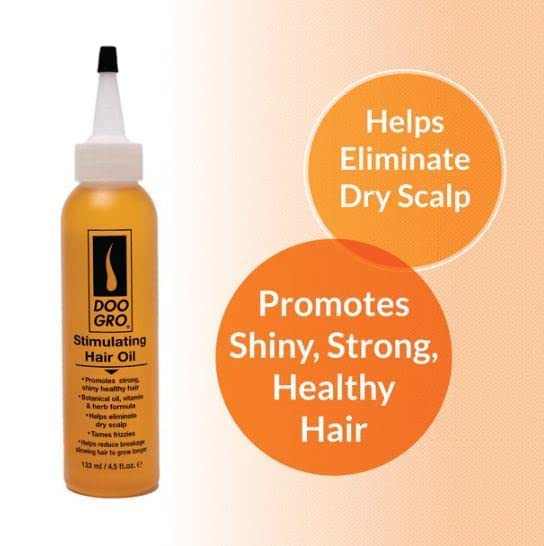 Doo GRO Stimulating Oil beside a towel for at-home treatment