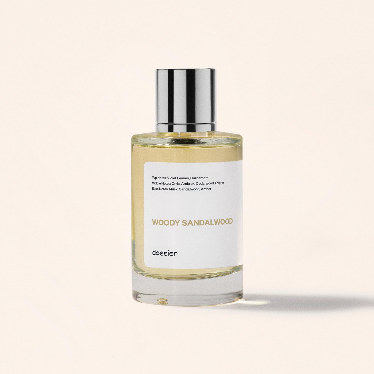 Dossier Woody Sandalwood spill shot evokes warm sandalwood notes