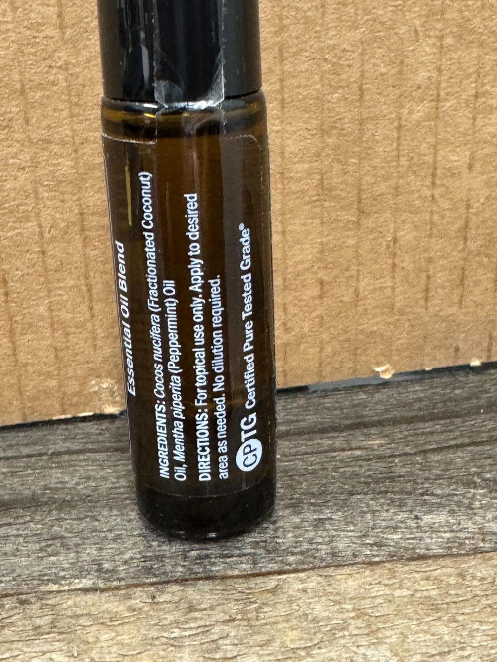 doTERRA Peppermint Touch bottle on table illustrating portable package