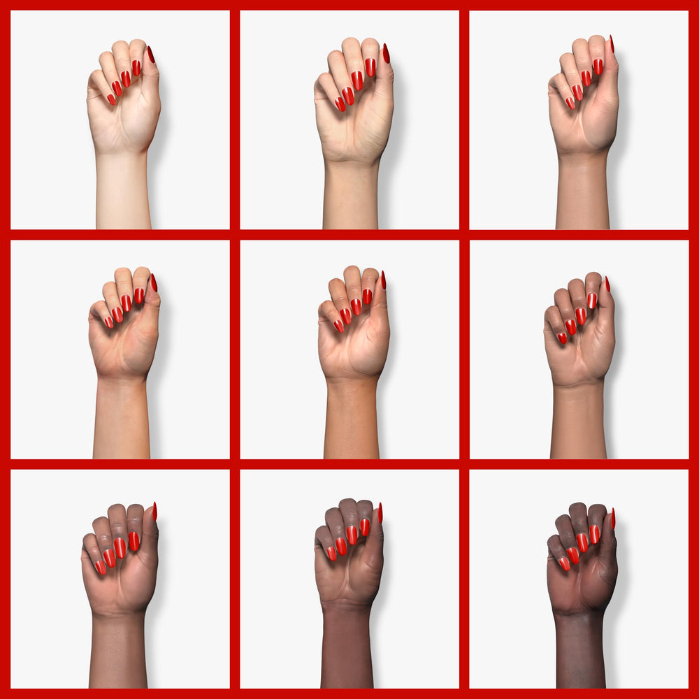 Double Rhythm bright red gel on nail displaying high-gloss shine.