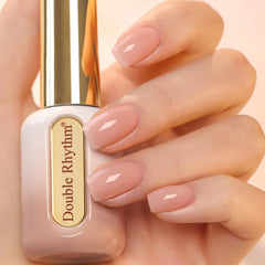 Double Rhythm gel polish bottle with gold handle for long-lasting shine.
