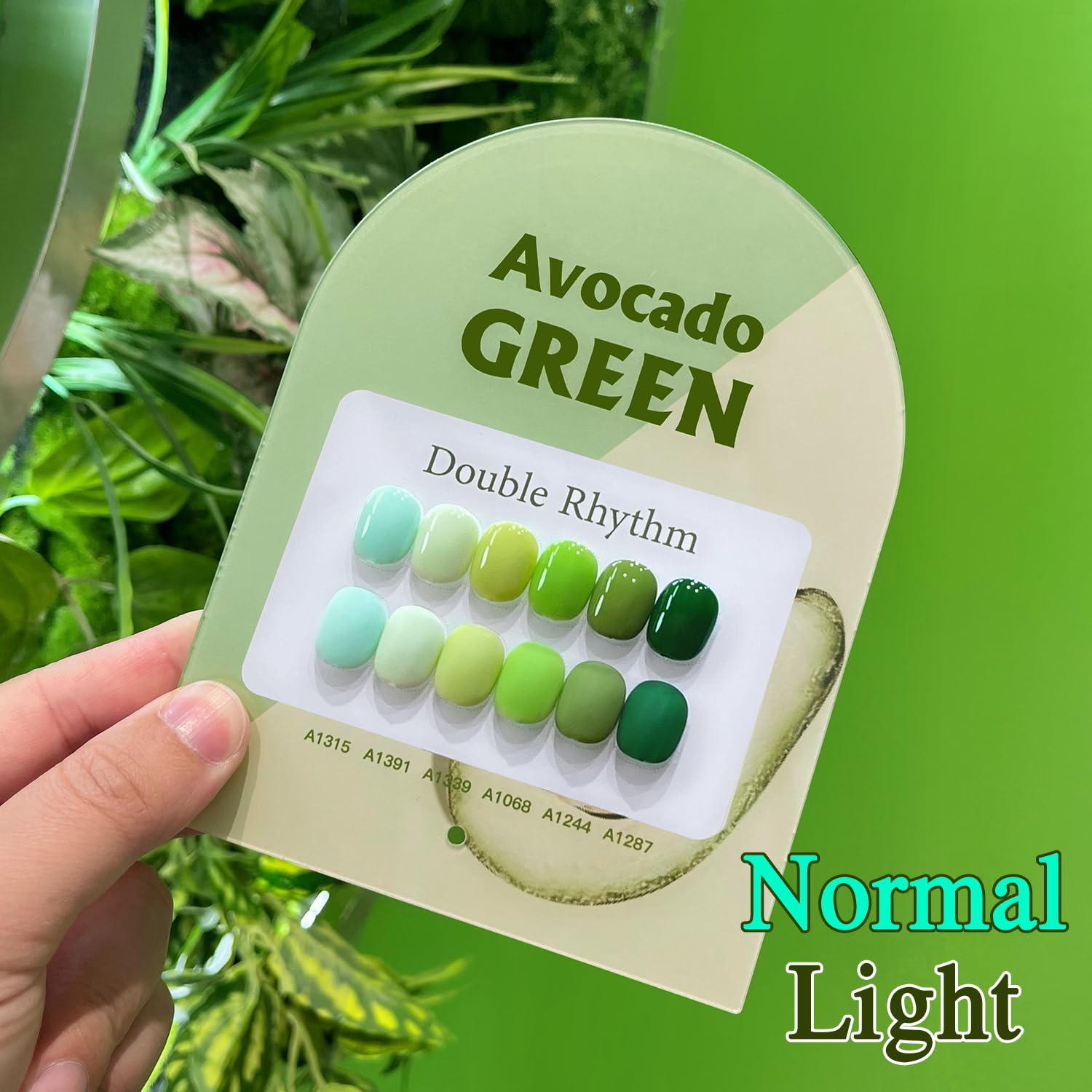 Double Rhythm nail art in olive-teal demonstrates stylish at-home manicure possibilities.