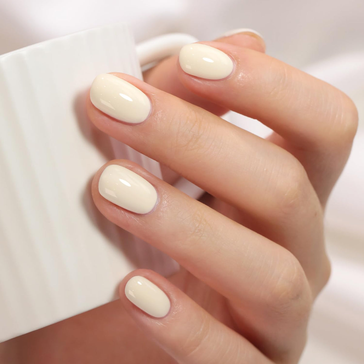 Double Rhythm beige-white gel polish bottle for versatile at-home manicures