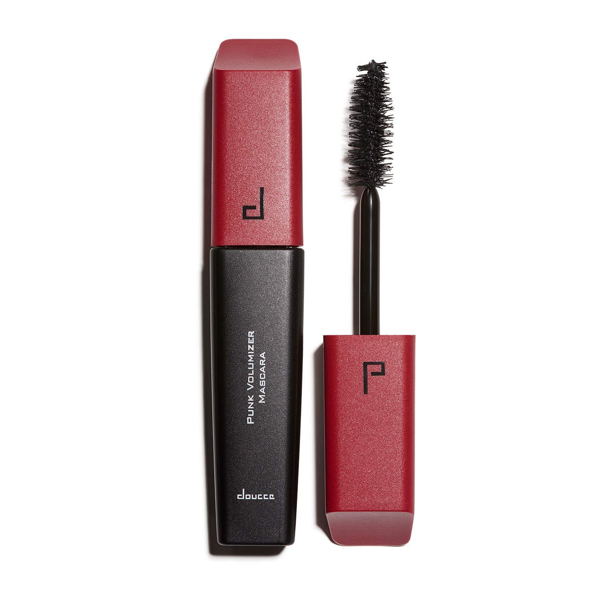 Doucce Punk Volumizer Mascara closeup of the XXL wand lifting and separating lashes.