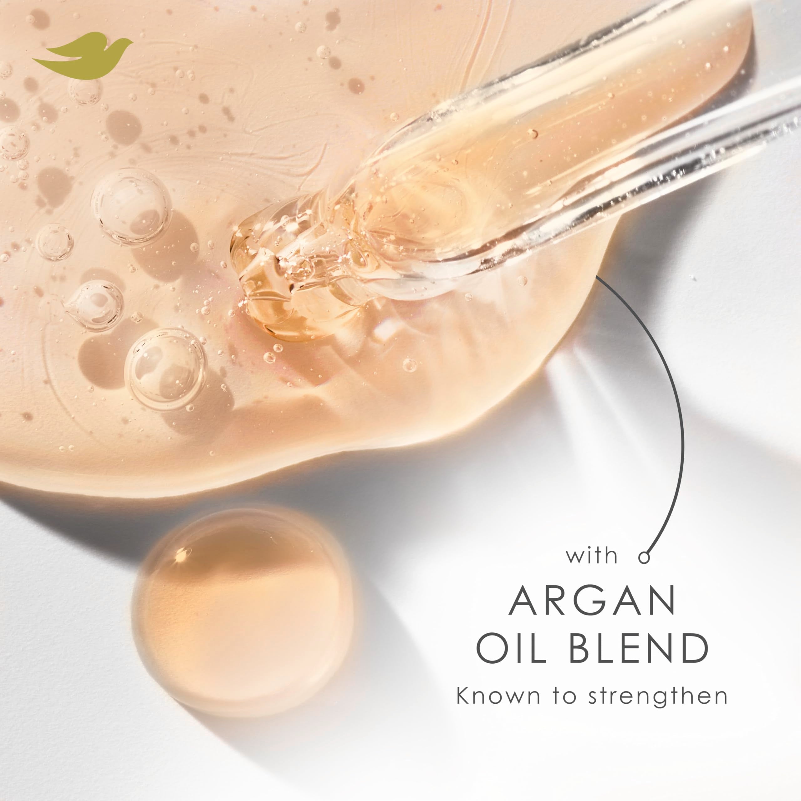Dove Argan Oil & Repair hair shine close-up showing smooth, manageable strands.