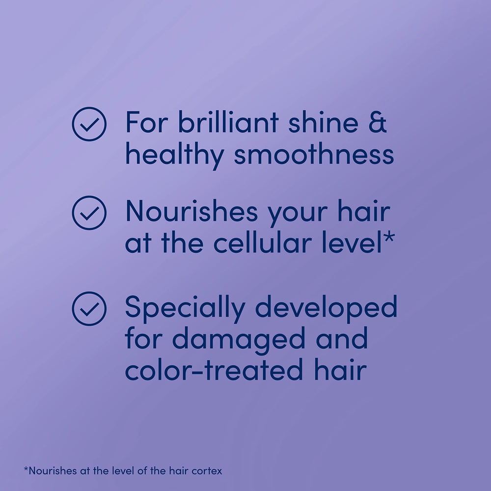 Color-treated hair framed by Dove Brilliant Gloss & Repair serum