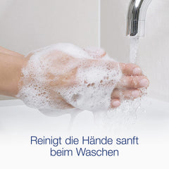 Pour action of Dove refill into dispenser for quick replenishment.