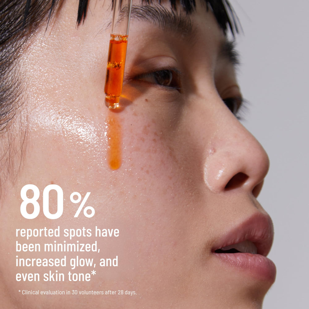 Dr. Brandt Bright This Way Glow Overnight Oil with sunscreen nearby for morning protection.
