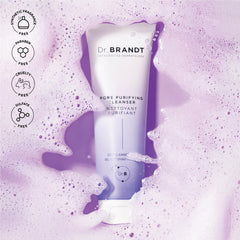 Hands applying Dr. Brandt Pores No More cleanser during morning routine