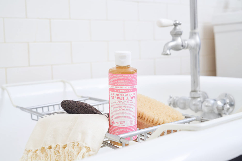 Pouring Dr. Bronner's Cherry Blossom soap to show easy dilution