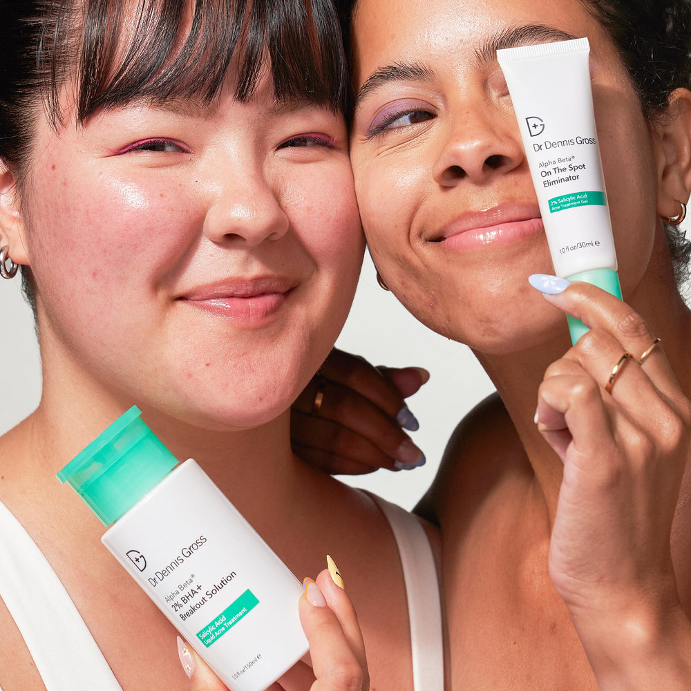 User applying product on forehead demonstrates daily acne spot care routine.