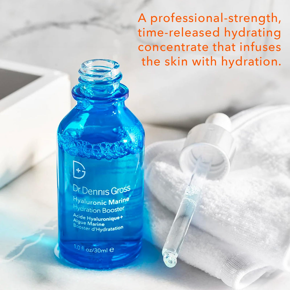 Dr Dennis Gross Hyaluronic Marine Hydration Booster applying to cheeks for smooth look.