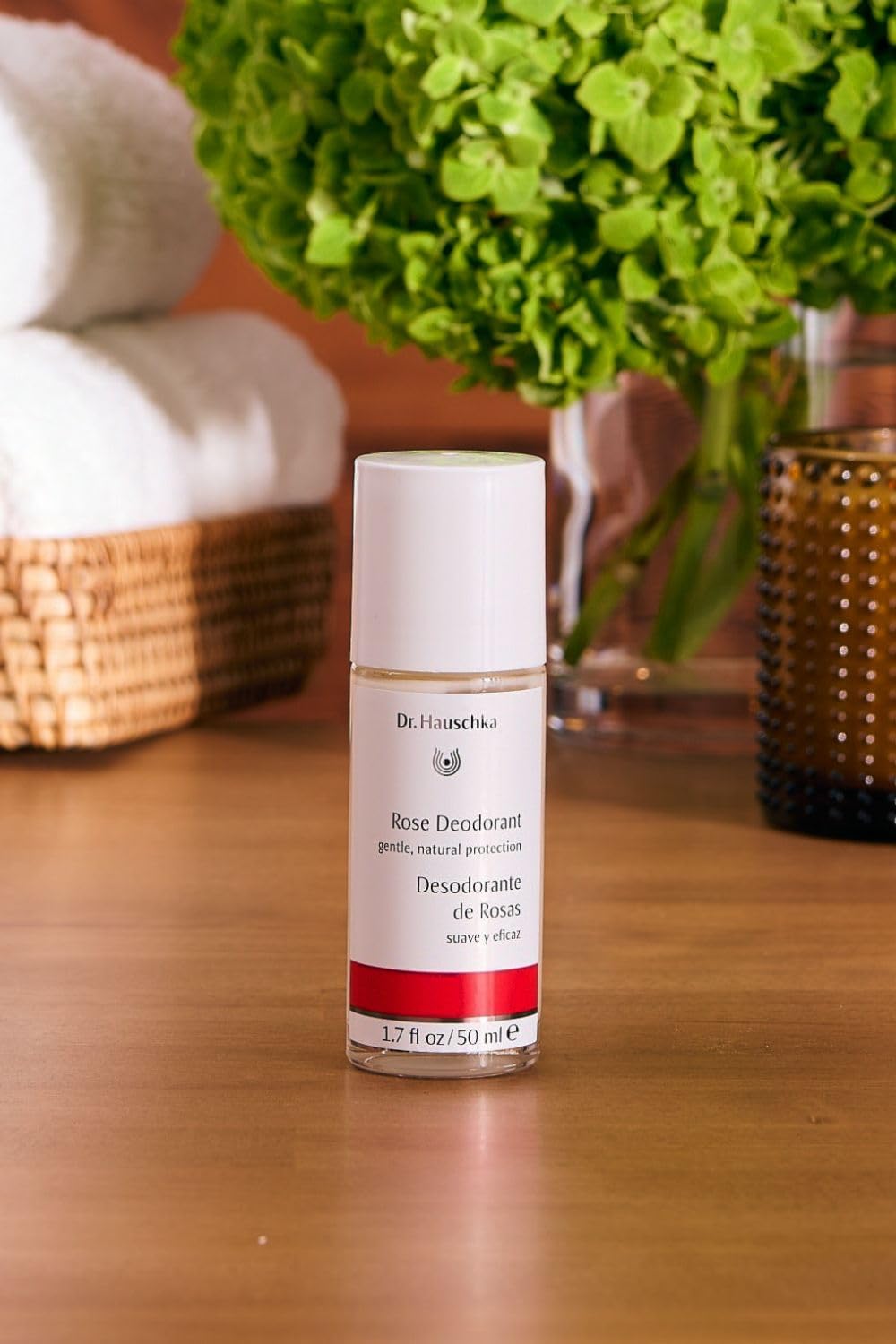 Dr Hauschka Rose Deodorant apply-motion demonstrates gentle back-and-forth use.