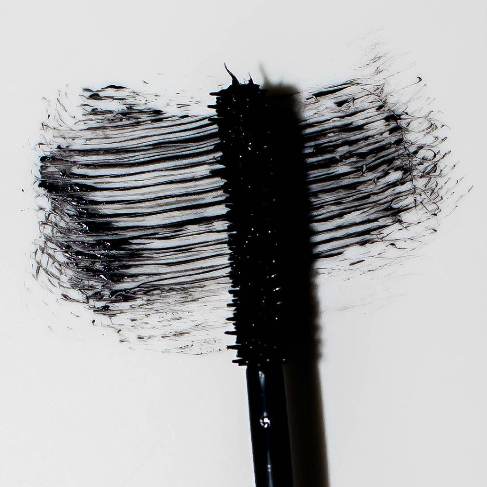 Lashes before application appear shorter with minimal curl.