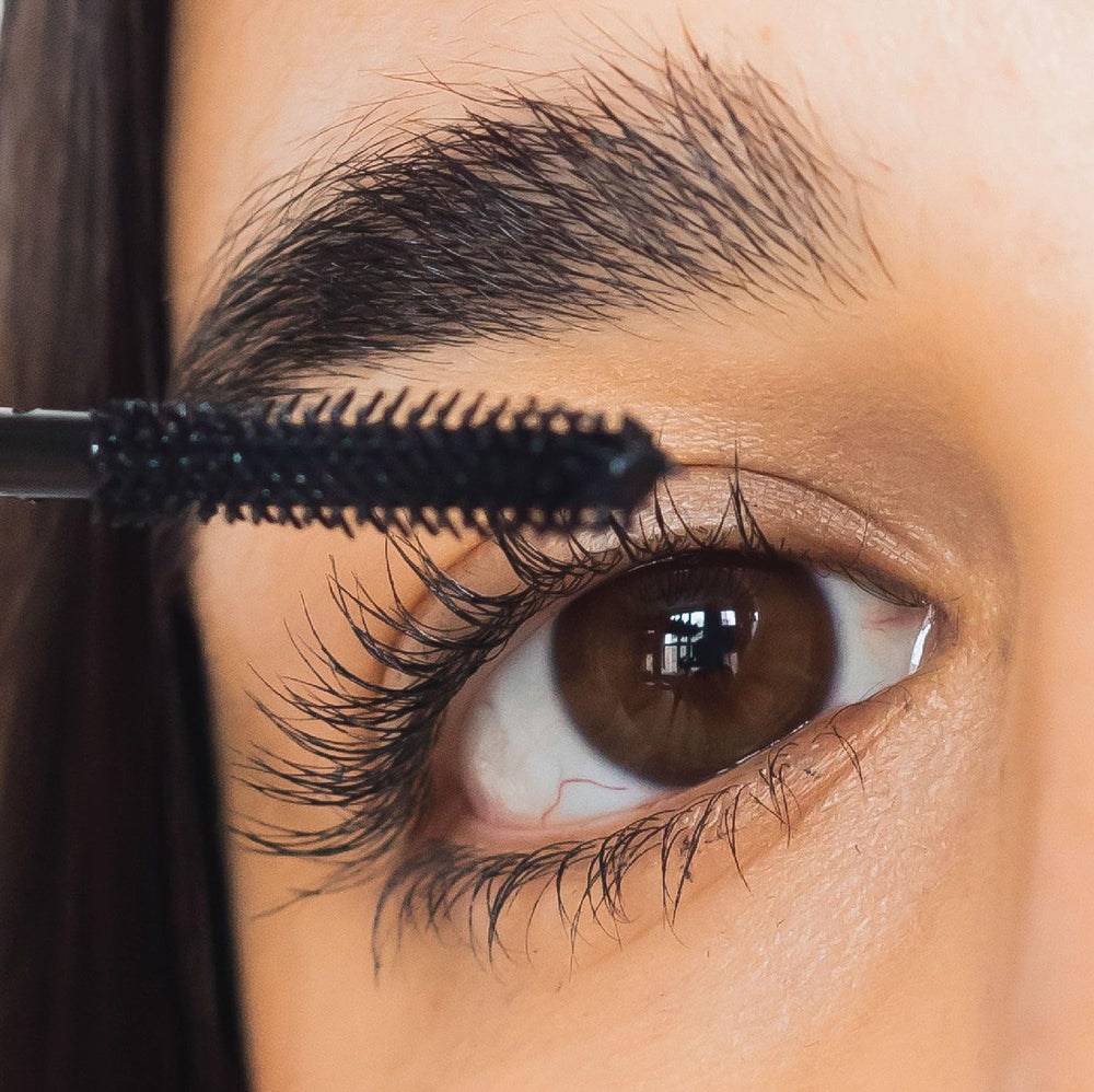 Swatch shows deep pigment and smooth mascara texture.