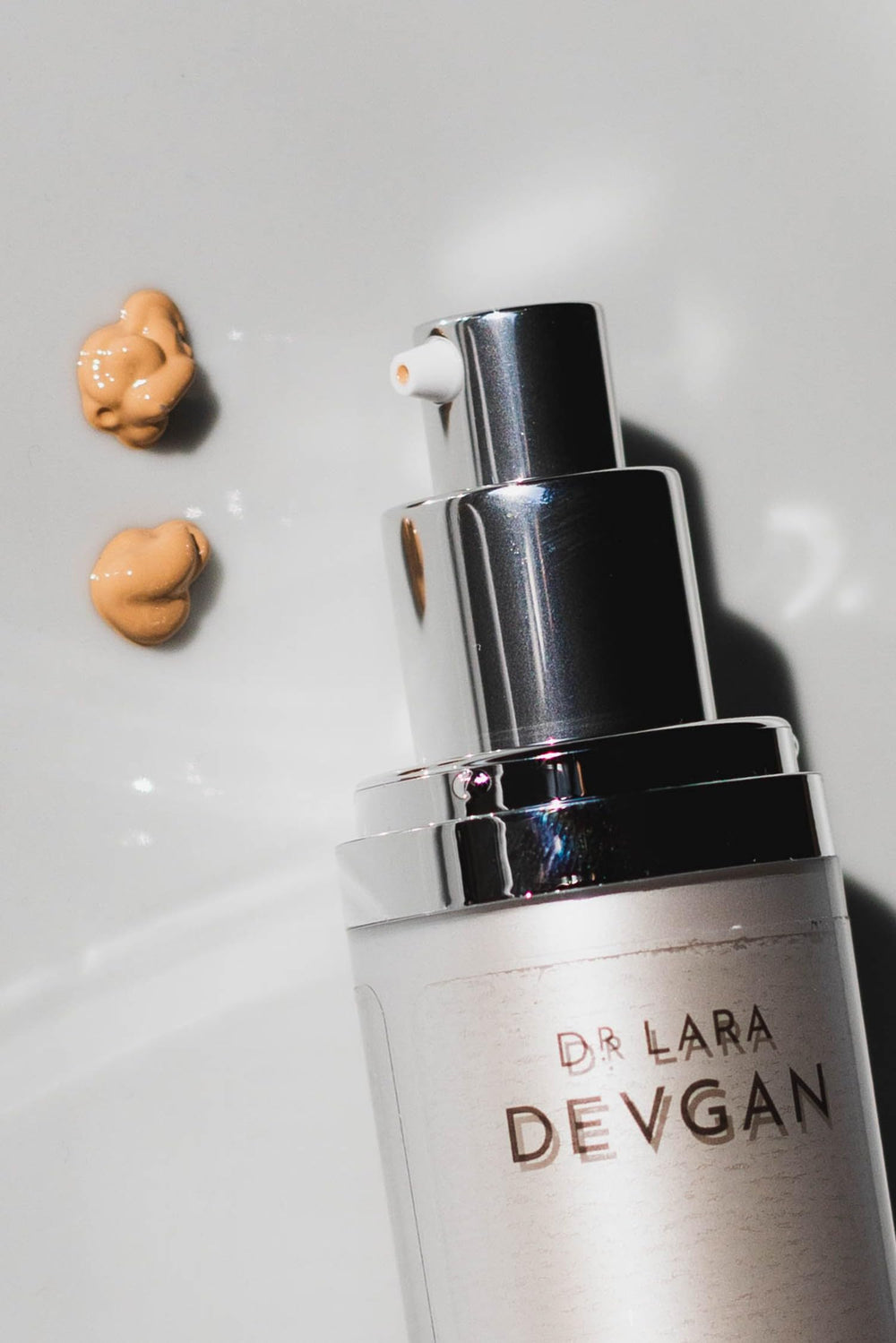 Swatch of Dr. Lara Devgan SPF 44 BB Cream shows light coverage and smooth texture.