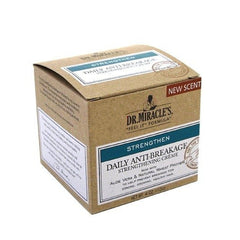 Spread evenly on the scalp with Dr. Miracle's Strengthen Daily Creme for even nourishment.