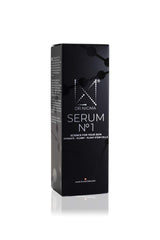 DR. Nigma Serum No 1 in hand, illustrating application for plump hydration