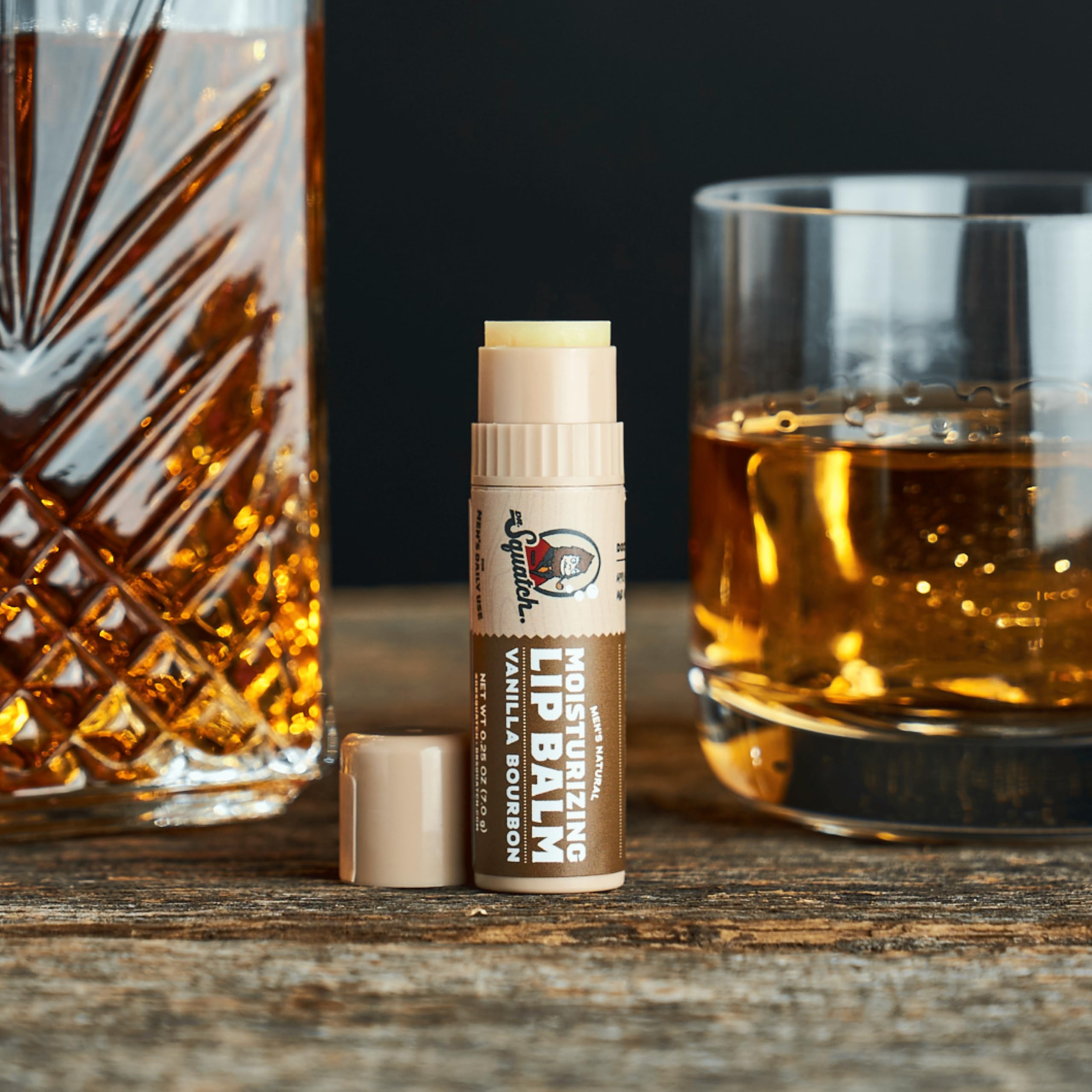 Dr. Squatch Vanilla Bourbon lip balm moisturizes and protects lips.