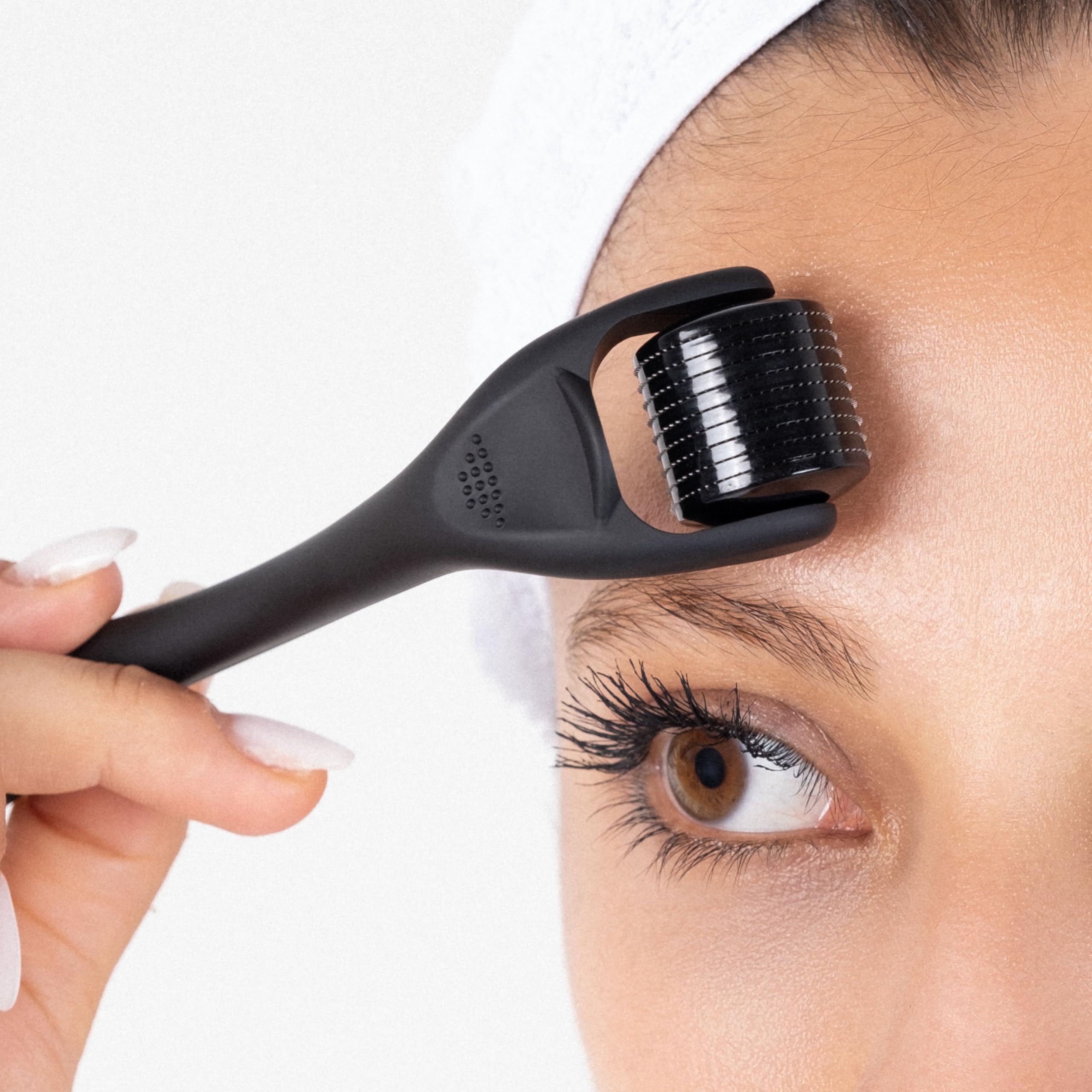 Dremenester roller shown for hair treatment use along the hairline.