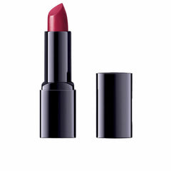 Dr Hauschka Amaryllis lipstick; vibrant red on lips with a hydrating, creamy texture.